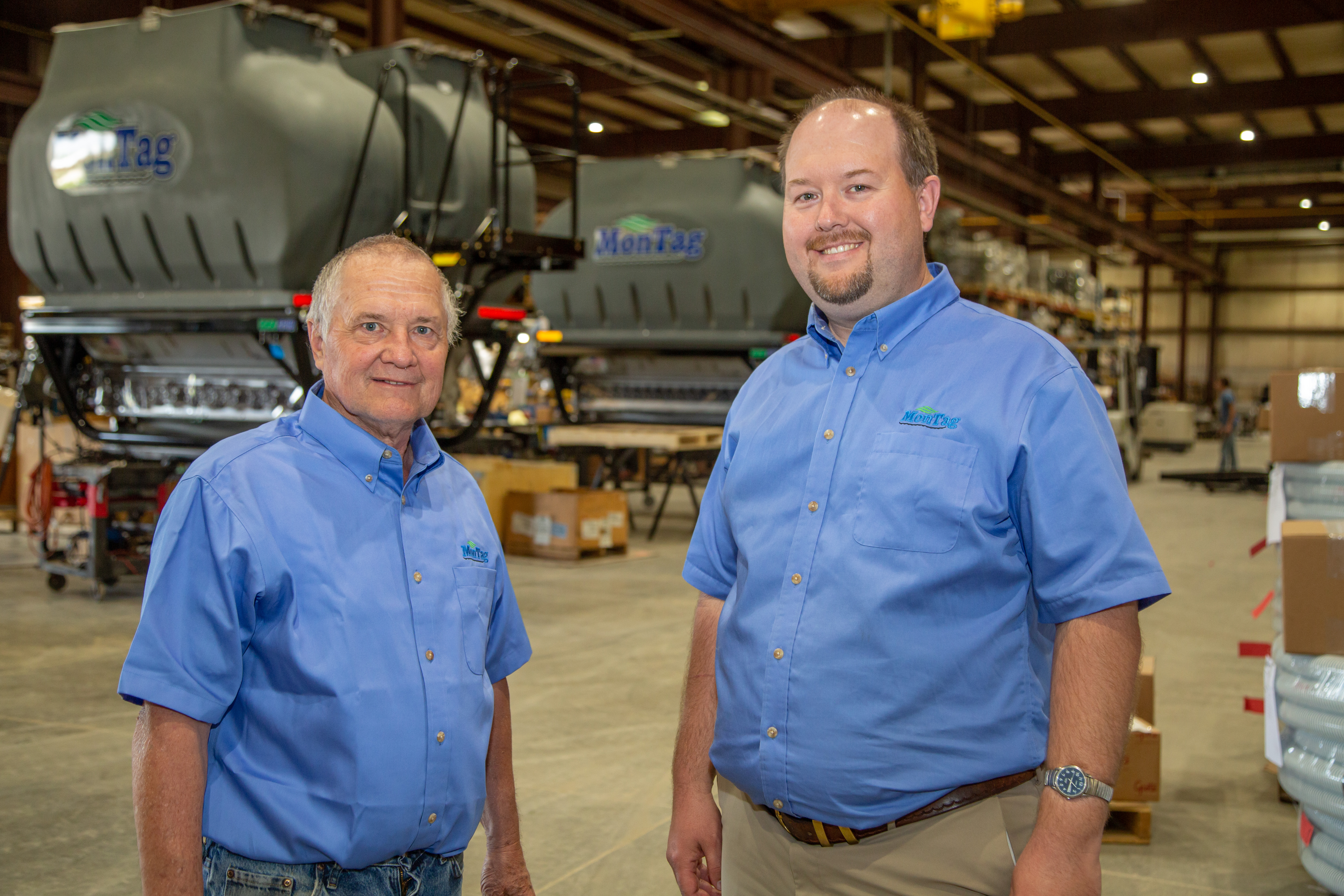 Roger and anthony standing in manufacturing facility