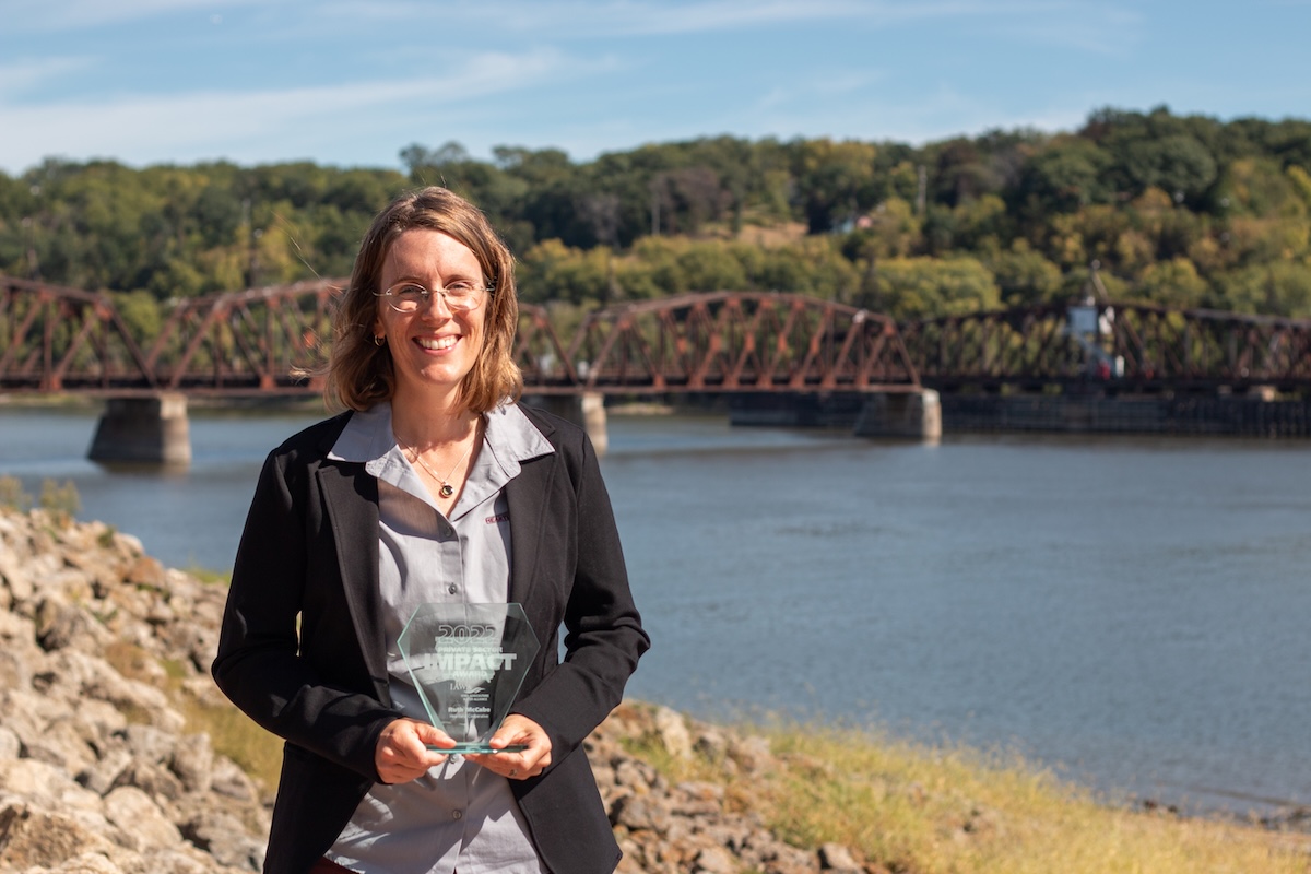 woman standing in front of river