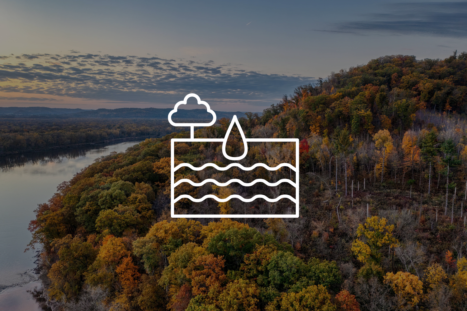 icon over bluff view in fall