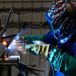 man welding with sparks flying