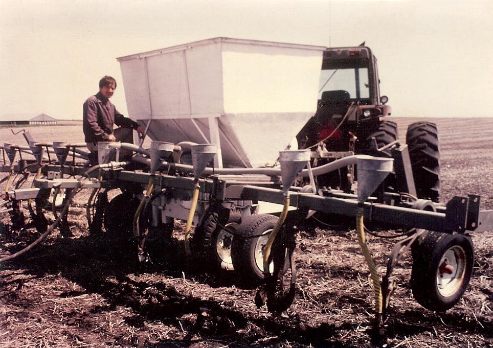 man on the back of tractor